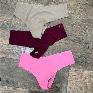 Victorias Secret Set of Three Seamless Thongs in Pink, Burgundy, and Gray